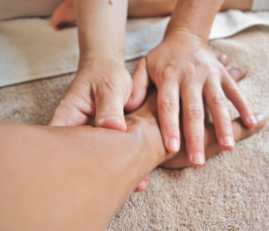 hands massaging an arm
